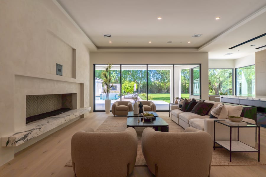 Finished living room opening onto a landscaped yard